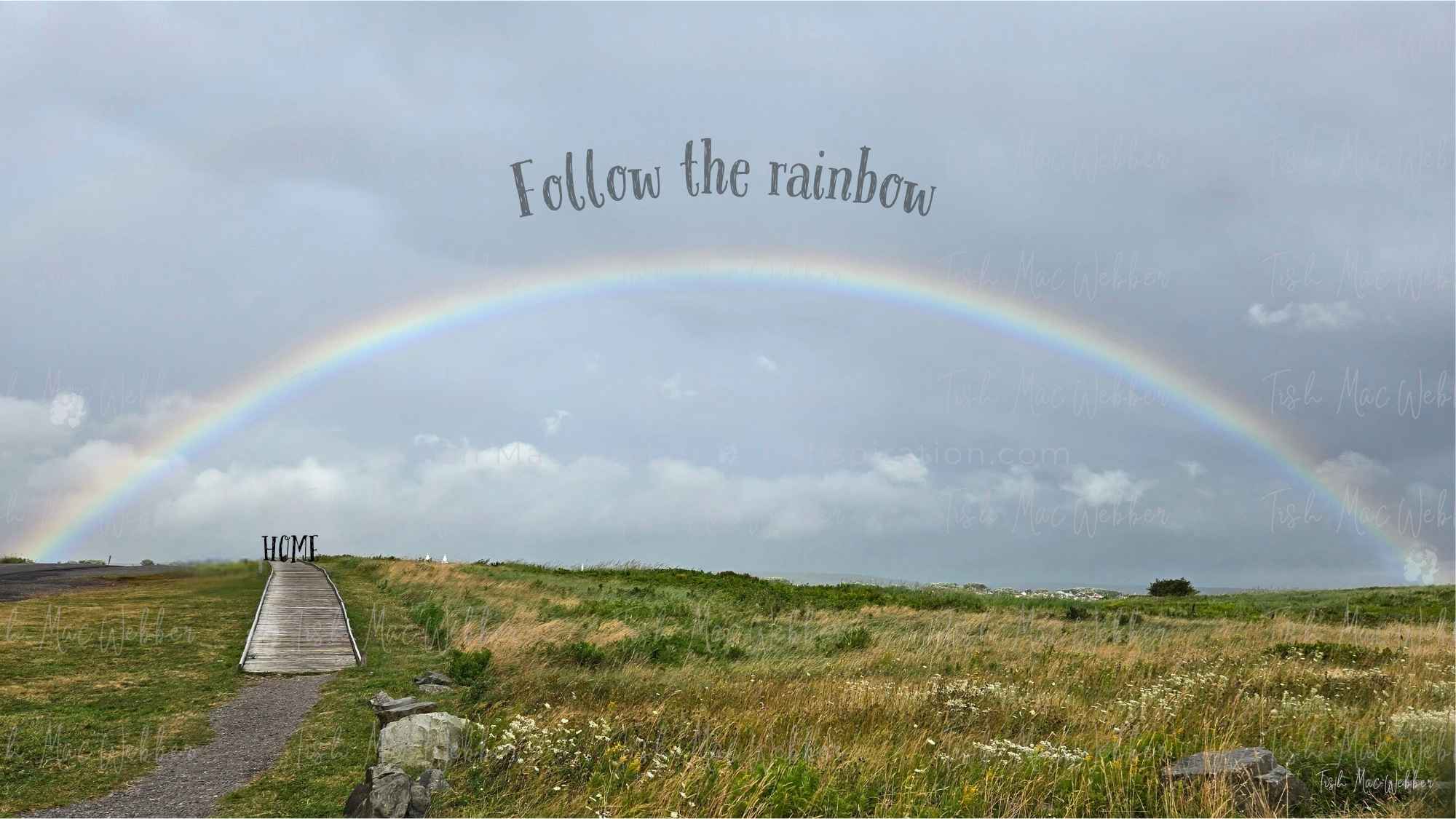 Full rainbow over the Inverness boardwalk and town in Cape Breton, Nova Scotia, with the words Follow the rainbow and HOME