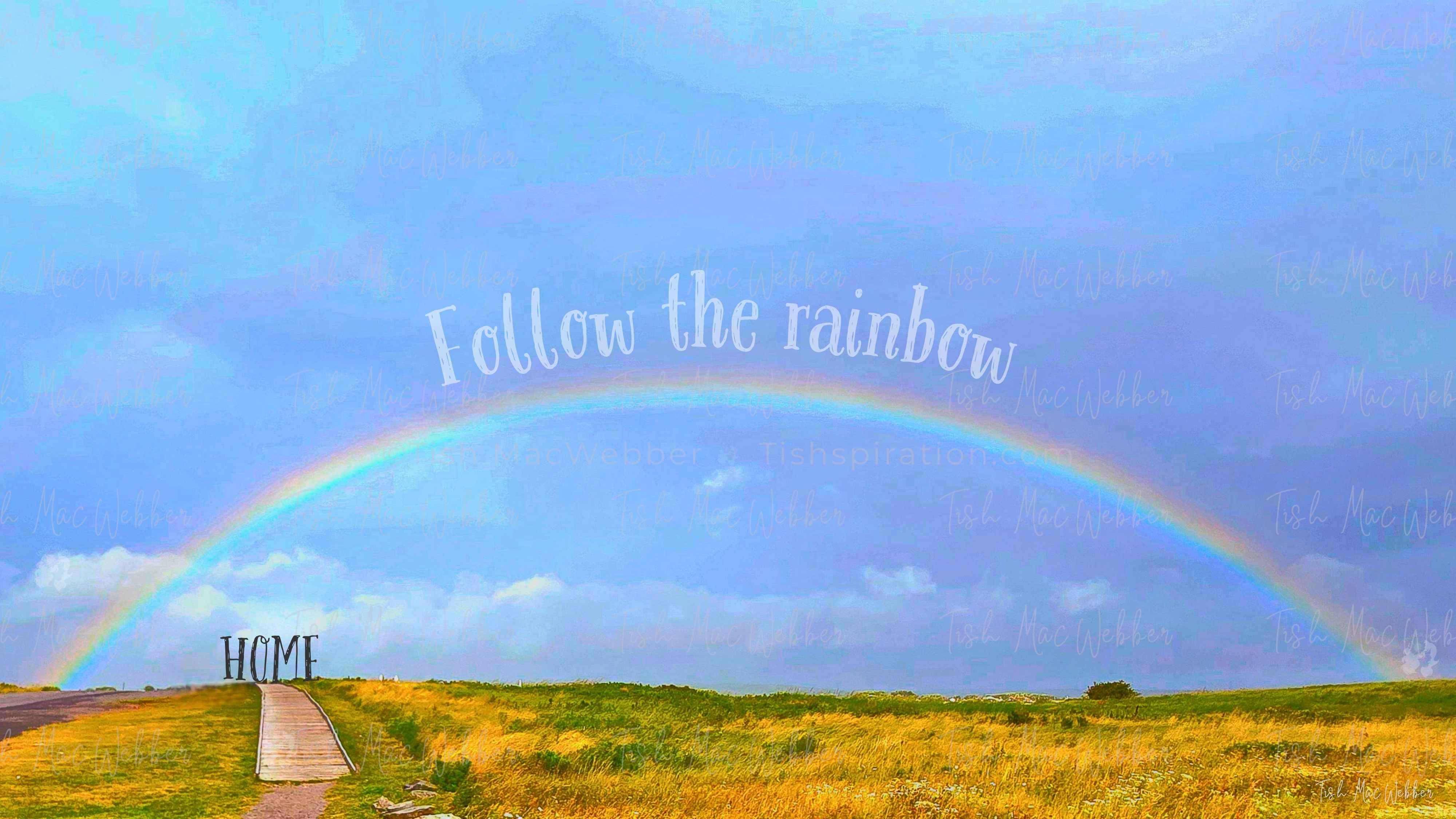 Vivid full rainbow over the Inverness boardwalk and town in Cape Breton, Nova Scotia, with the words Follow the rainbow and HOME