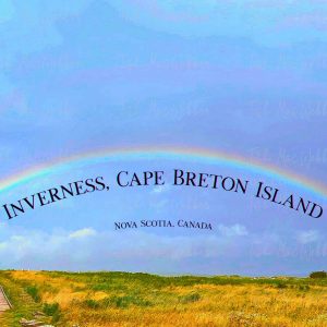 Vivid full rainbow over the Inverness boardwalk and town in Cape Breton, Nova Scotia, with the Inverness sign and the words Inverness, Cape Breton Island, Nova Scotia, Canada